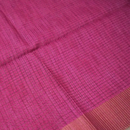 Harini Tussar in soft white base with colorful leaf motifs in blue, orange, and mustard, complemented by a rich maroon border.