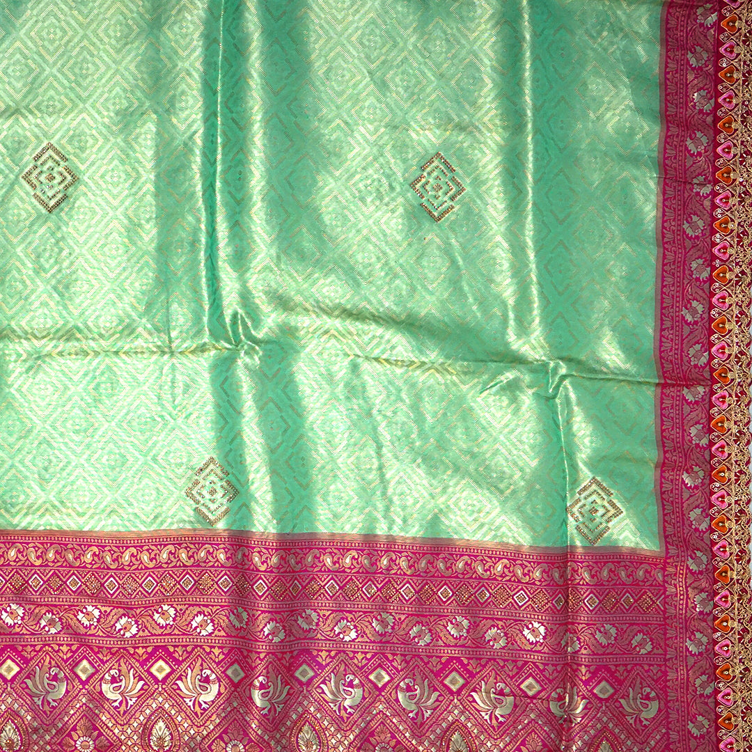 Mint Green Raj Virasat Silk saree with Deep purple base and heavy embroidery.