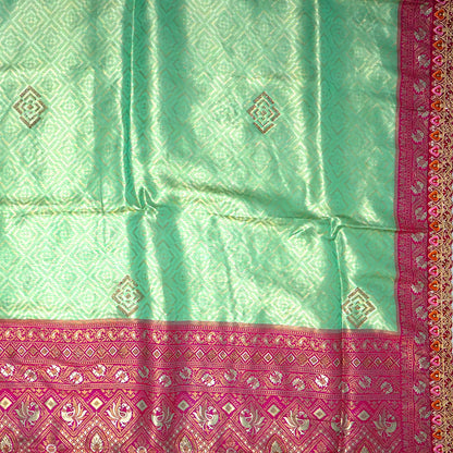 Mint Green Raj Virasat Silk saree with Deep purple base and heavy embroidery.