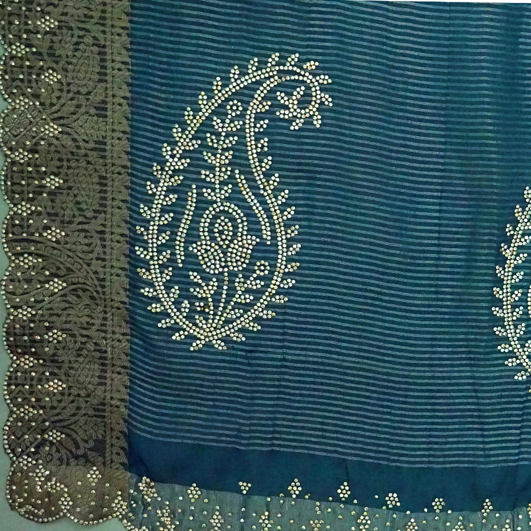 Ratnalekha silk saree in rich teal-blue base adorned with intricate gold zari work,
