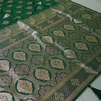 Rithvi Satin Emerald-green shade color adorned with intricate golden zari embroidery