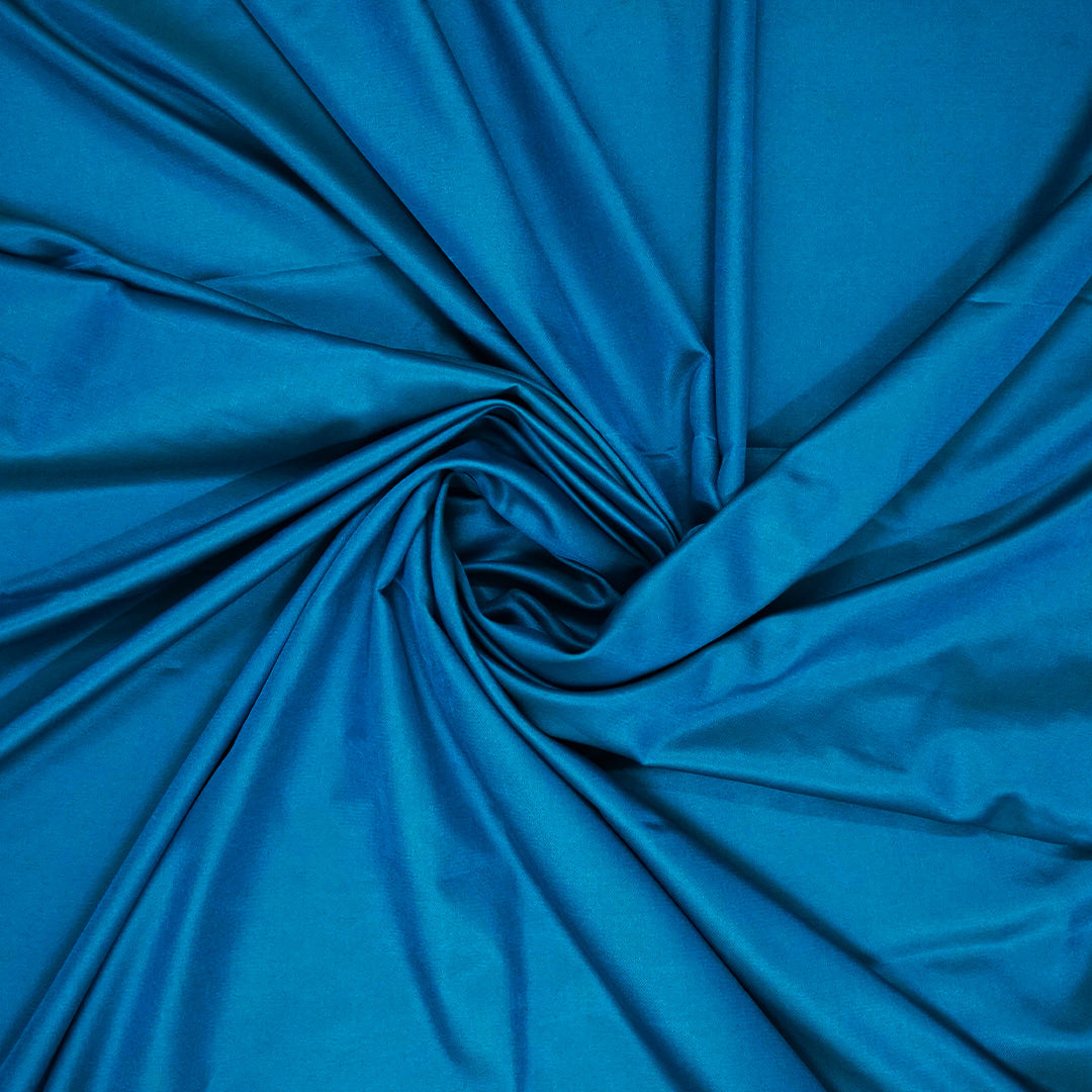 Hamsini Silk saree in Vibrant teal blue shade with a lustrous silk texture.