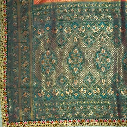 Peach-orange Raj Virasat Silk saree with Deep purple base and heavy embroidery.