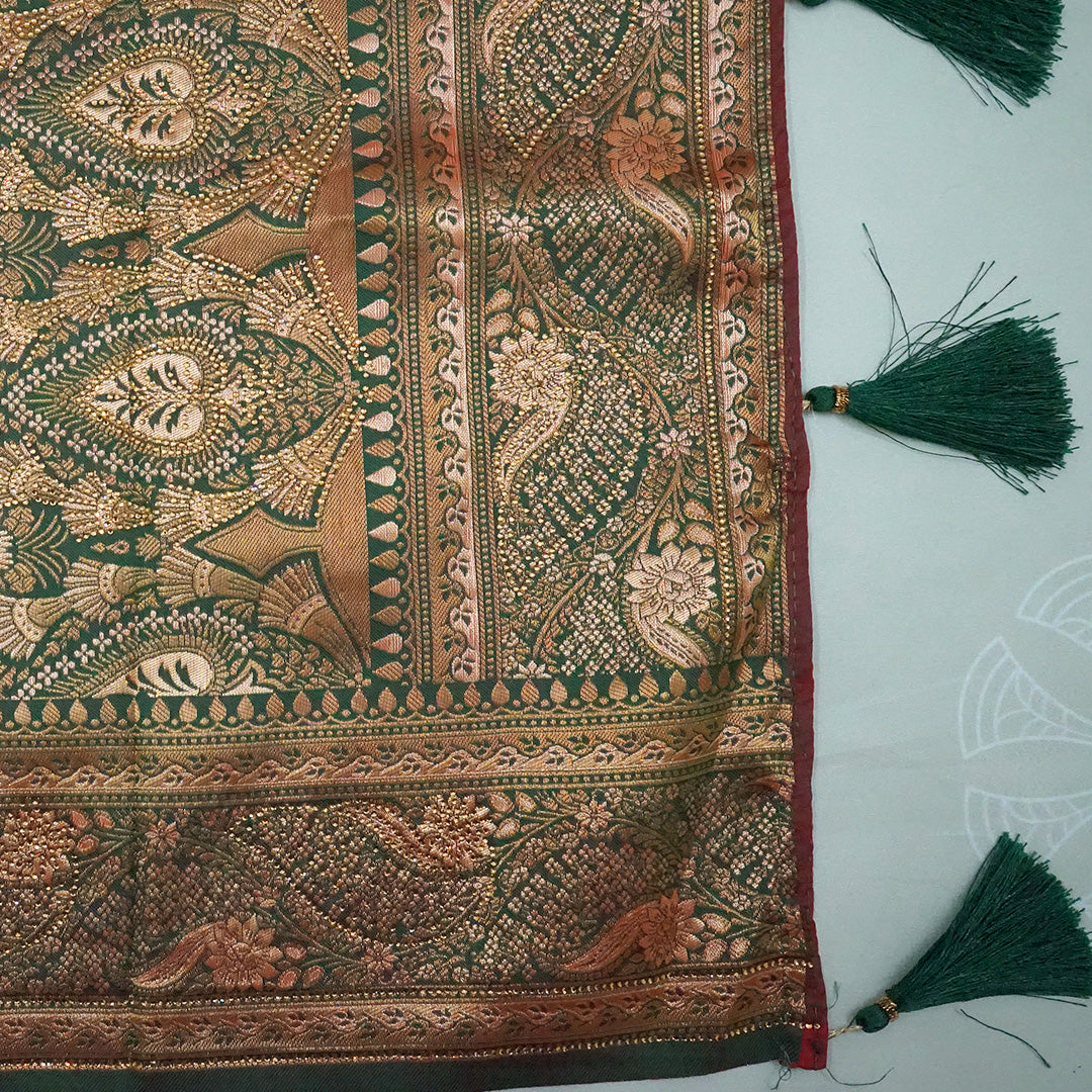 Madhur Bela rich coral-orange shade with a golden undertone.