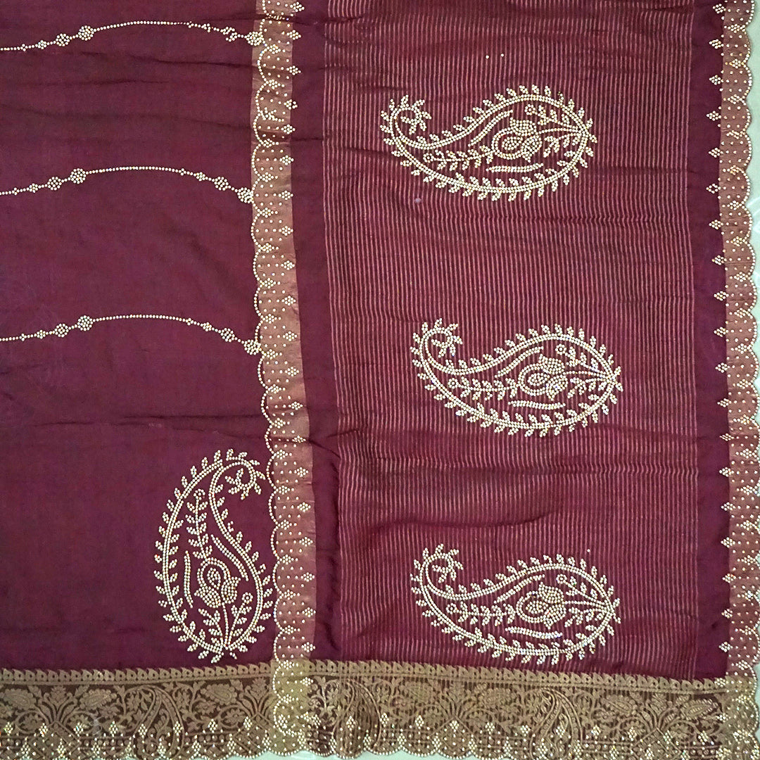Ratnalekha Silk saree in rich wine-maroon base adorned with intricate gold zari embroidery