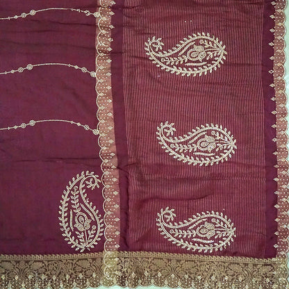 Ratnalekha Silk saree in rich wine-maroon base adorned with intricate gold zari embroidery