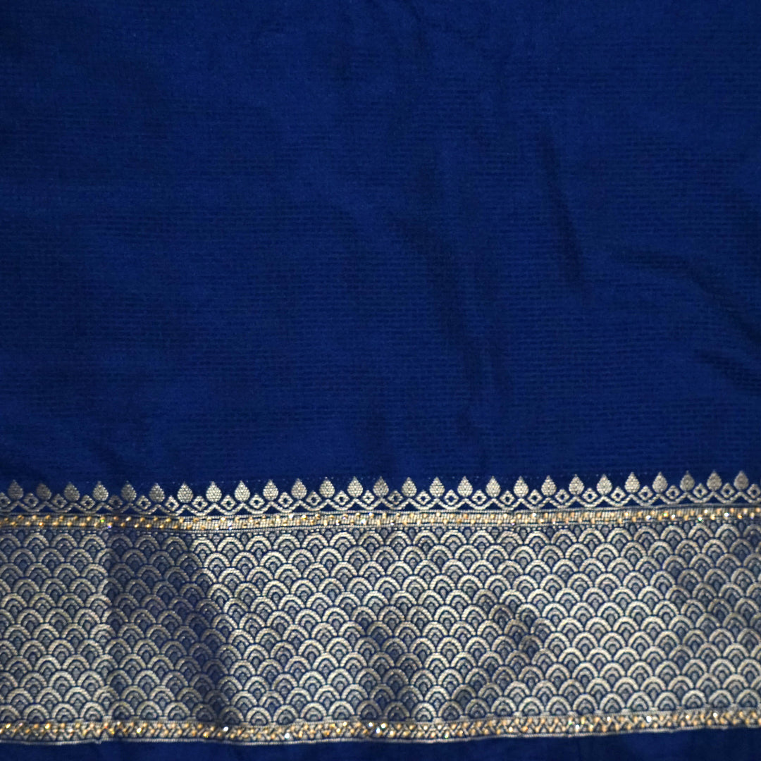 Megha Silk saree in rich royal blue with alternating metallic gold zari stripes.