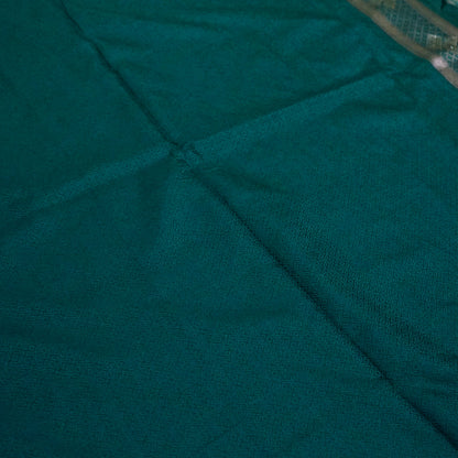 Rithvi Satin Teal blue color adorned with intricate golden zari embroidery