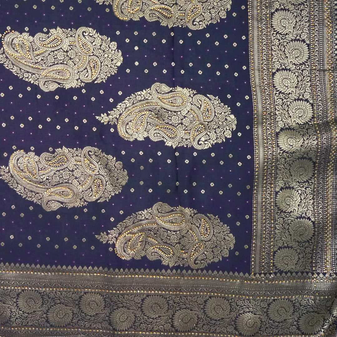 Tarani Silk saree in royal deep purple shade with a rich golden zari weave.