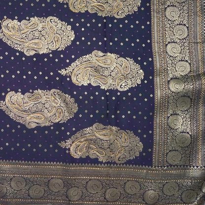 Tarani Silk saree in royal deep purple shade with a rich golden zari weave.