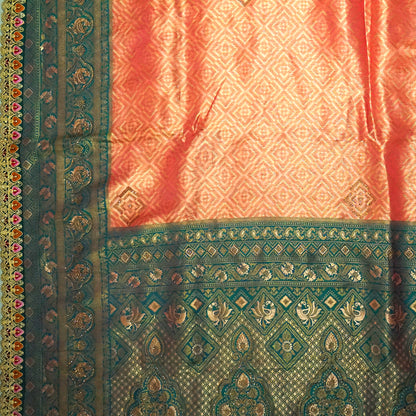 Peach-orange Raj Virasat Silk saree with Deep purple base and heavy embroidery.