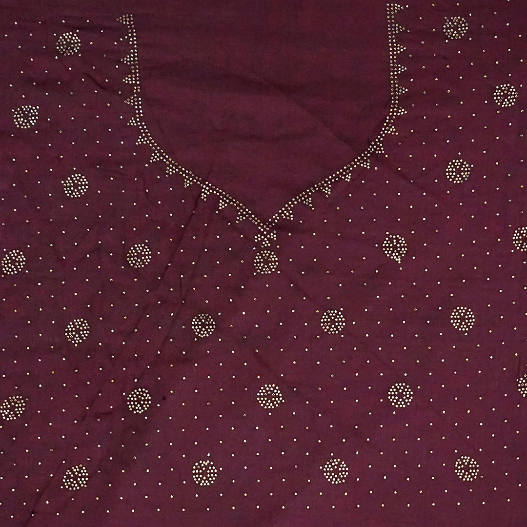 Ratnalekha Silk saree in rich wine-maroon base adorned with intricate gold zari embroidery