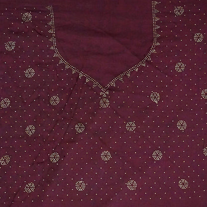 Ratnalekha Silk saree in rich wine-maroon base adorned with intricate gold zari embroidery