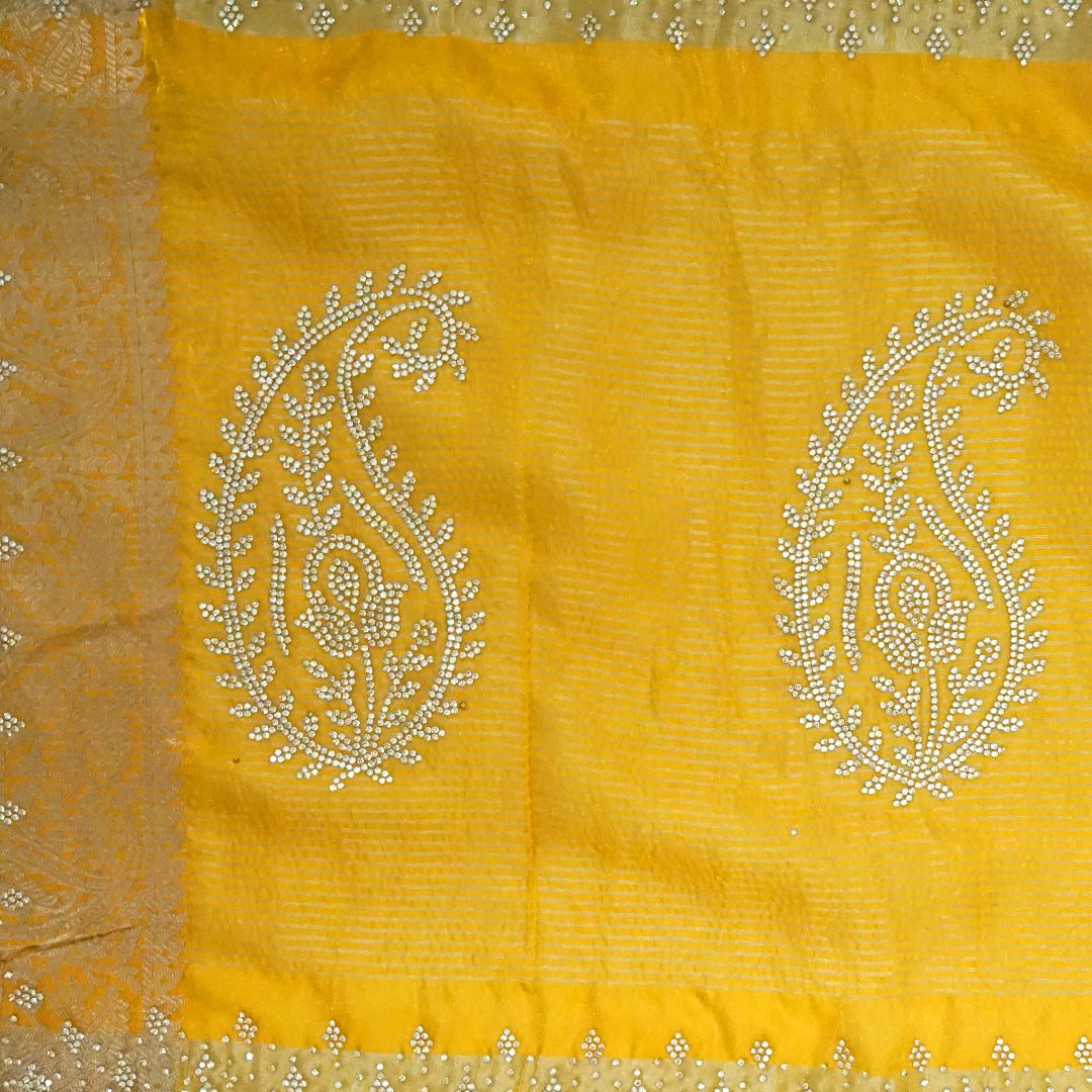 Ratnalekha Silk saree in rich golden yellow base highlighted with intricate silver zari embroidery