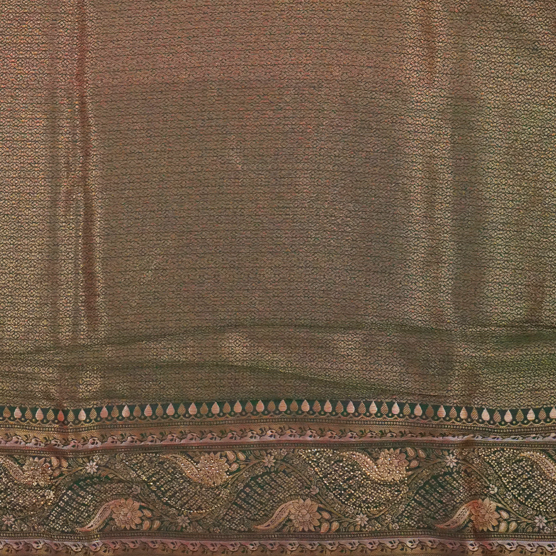 Madhur Bela rich coral-orange shade with a golden undertone.