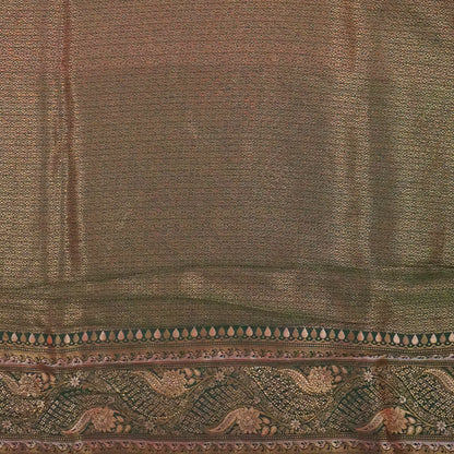 Madhur Bela rich coral-orange shade with a golden undertone.