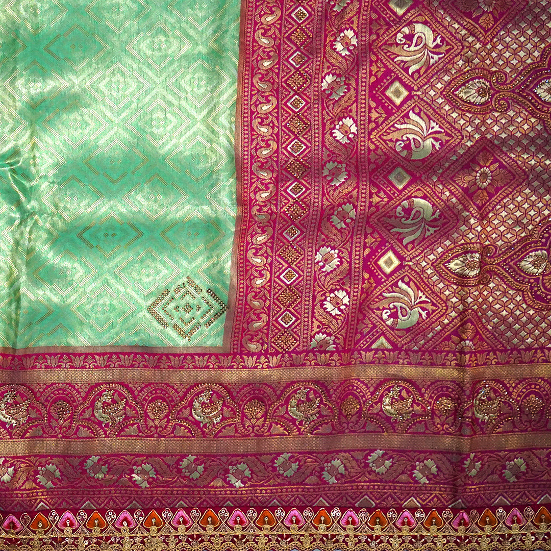 Mint Green Raj Virasat Silk saree with Deep purple base and heavy embroidery.