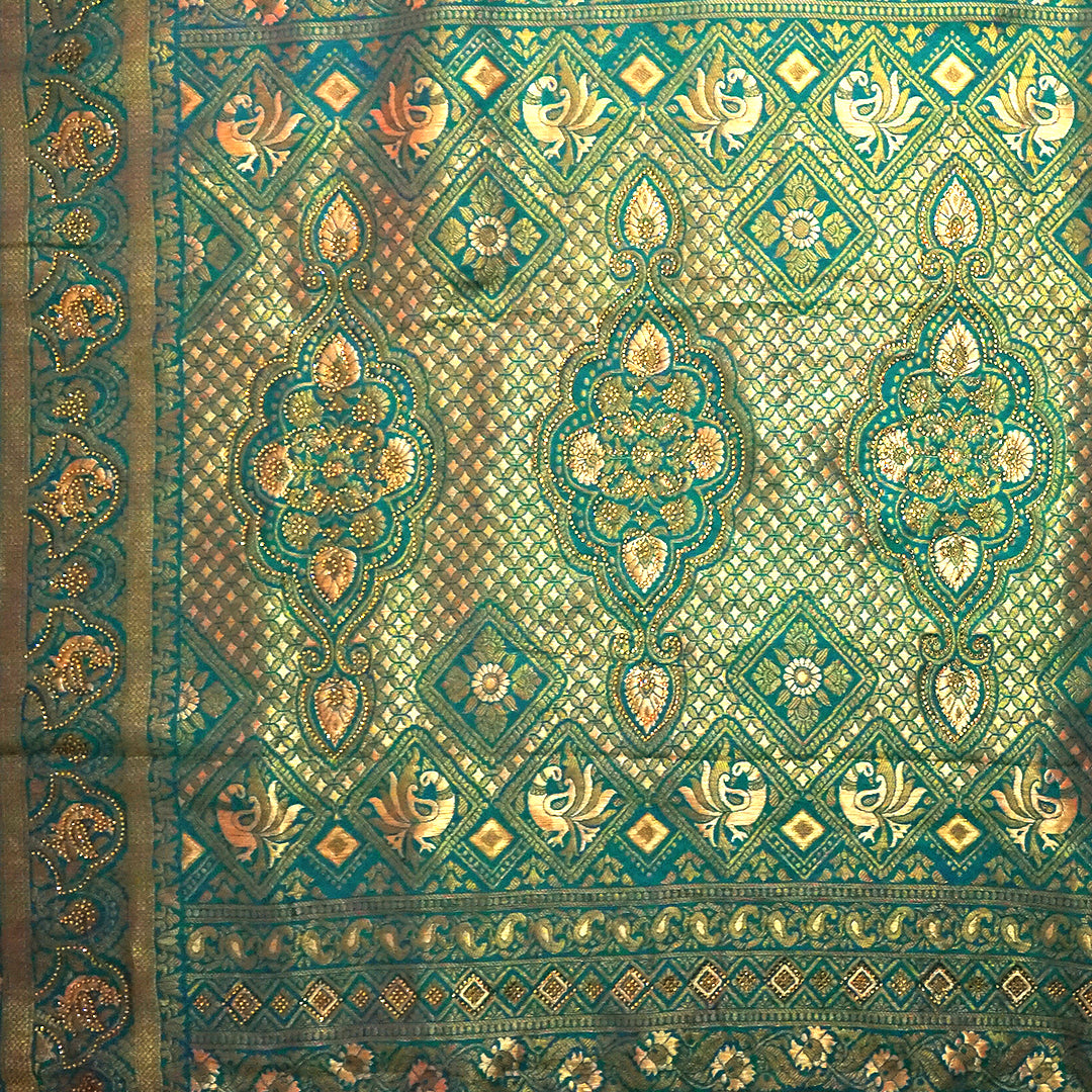 Peach-orange Raj Virasat Silk saree with Deep purple base and heavy embroidery.