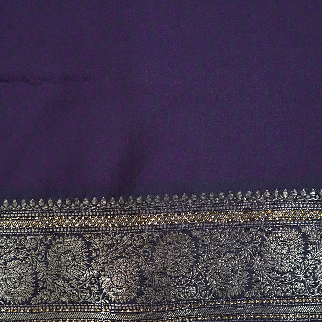 Tarani Silk saree in royal deep purple shade with a rich golden zari weave.
