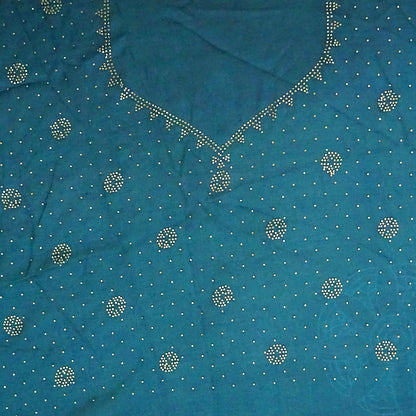 Ratnalekha silk saree in rich teal-blue base adorned with intricate gold zari work,