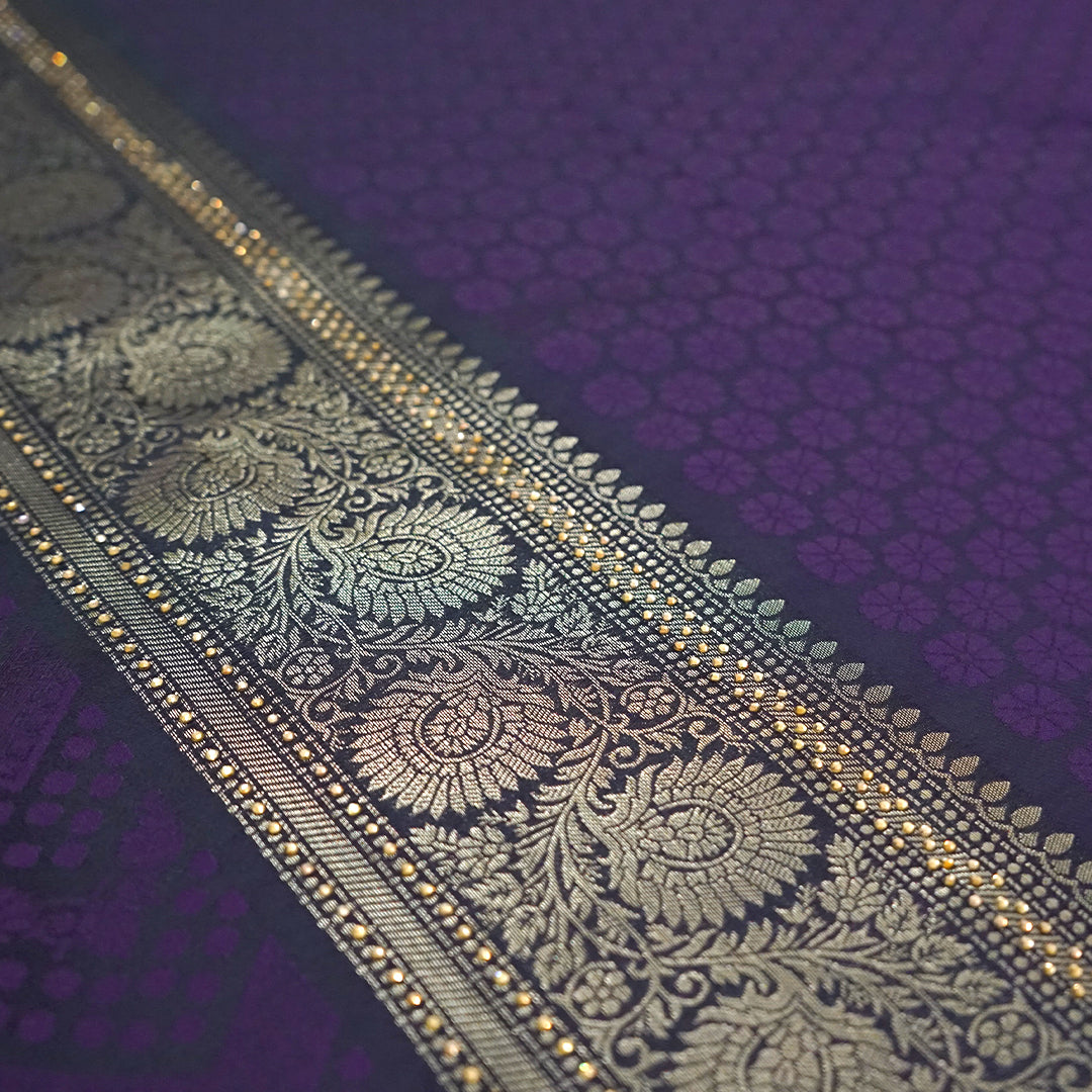 Tarani Silk saree in royal deep purple shade with a rich golden zari weave.