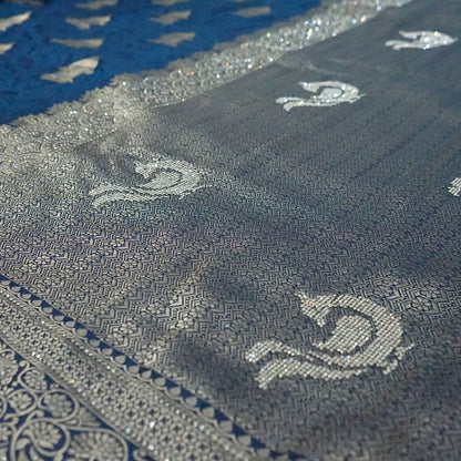 Royal Ratha Banarasi Silk in rich royal blue shade, beautifully complemented with silver zari motifs