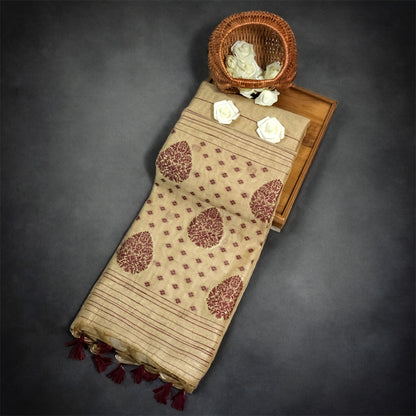Beige Ishvani Tussar saree with Maroon tassels