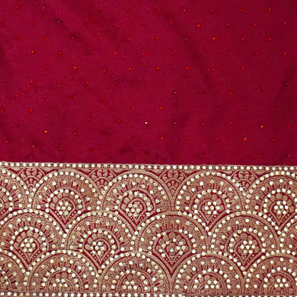 Royal Ratha Banarasi silk in deep maroon red shade, highlighted with rich golden zari motifs and an ornate golden border.