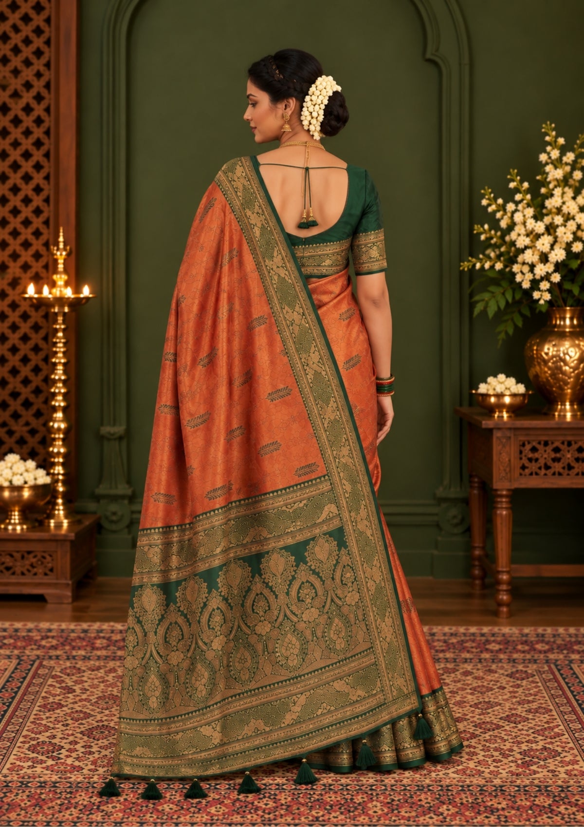 Madhur Bela rich coral-orange shade with a golden undertone.