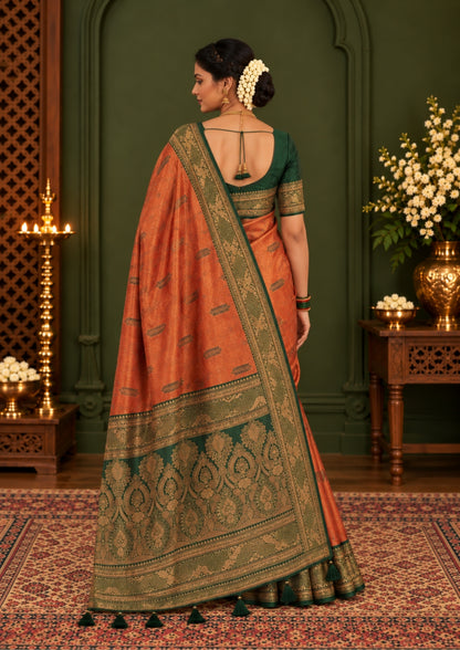Madhur Bela rich coral-orange shade with a golden undertone.