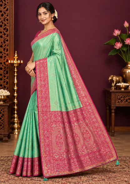 Mint Green Raj Virasat Silk saree with Deep purple base and heavy embroidery.