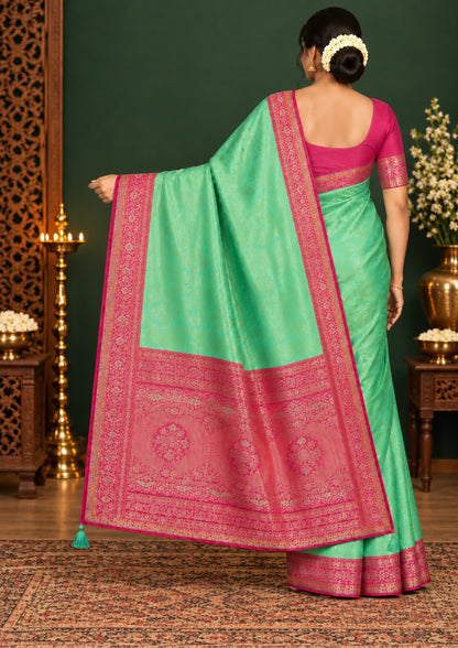 Mint Green Raj Virasat Silk saree with Deep purple base and heavy embroidery.