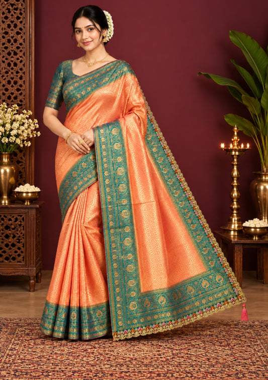 Peach-orange Raj Virasat Silk saree with Deep purple base and heavy embroidery.