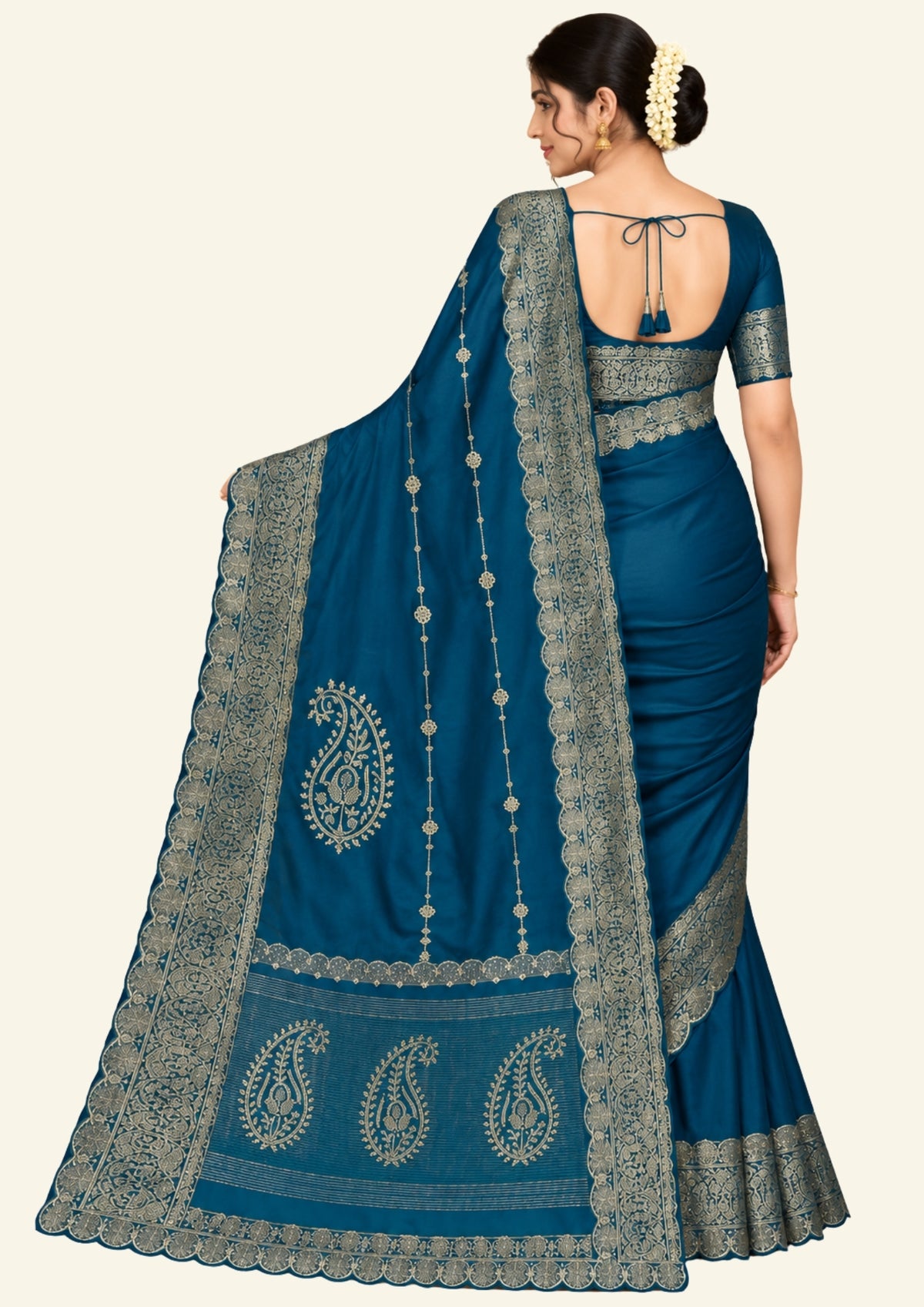 Ratnalekha silk saree in rich teal-blue base adorned with intricate gold zari work,