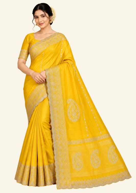 Ratnalekha Silk saree in rich golden yellow base highlighted with intricate silver zari embroidery