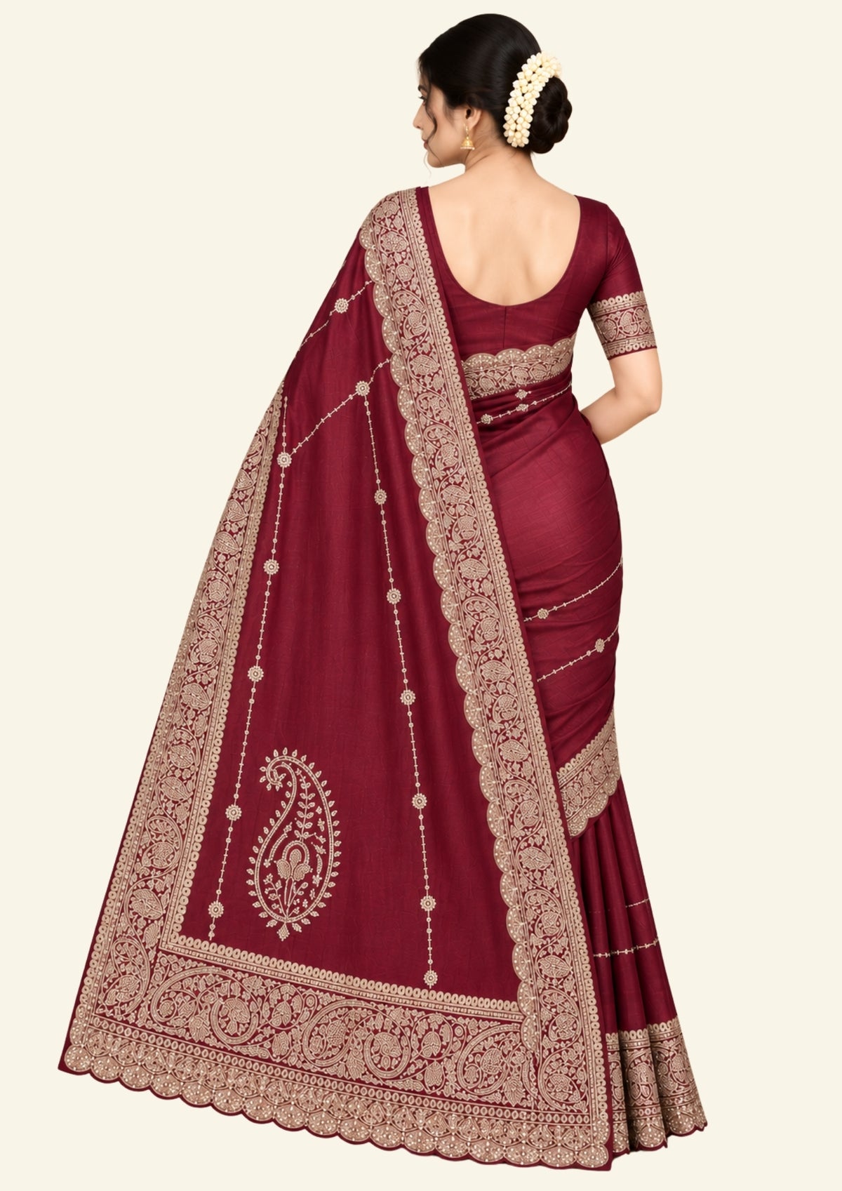 Ratnalekha Silk saree in rich wine-maroon base adorned with intricate gold zari embroidery