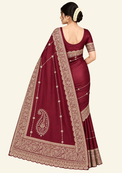 Ratnalekha Silk saree in rich wine-maroon base adorned with intricate gold zari embroidery
