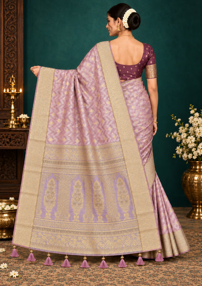 Vedika Silk saree in soft pastel pink shade with a luxurious golden zari weave.