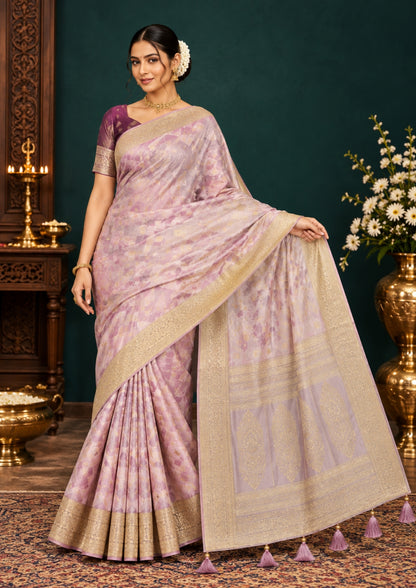 Vedika Silk saree in soft pastel pink shade with a luxurious golden zari weave.