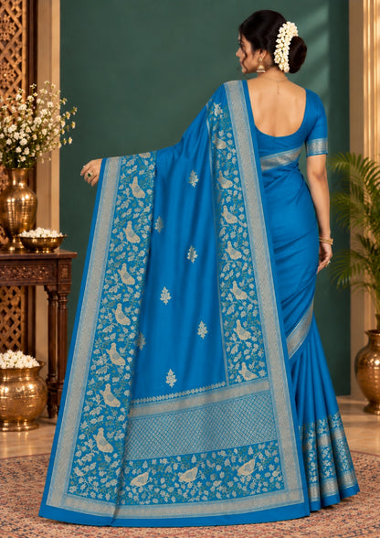 Hamsini Silk saree in Vibrant teal blue shade with a lustrous silk texture.