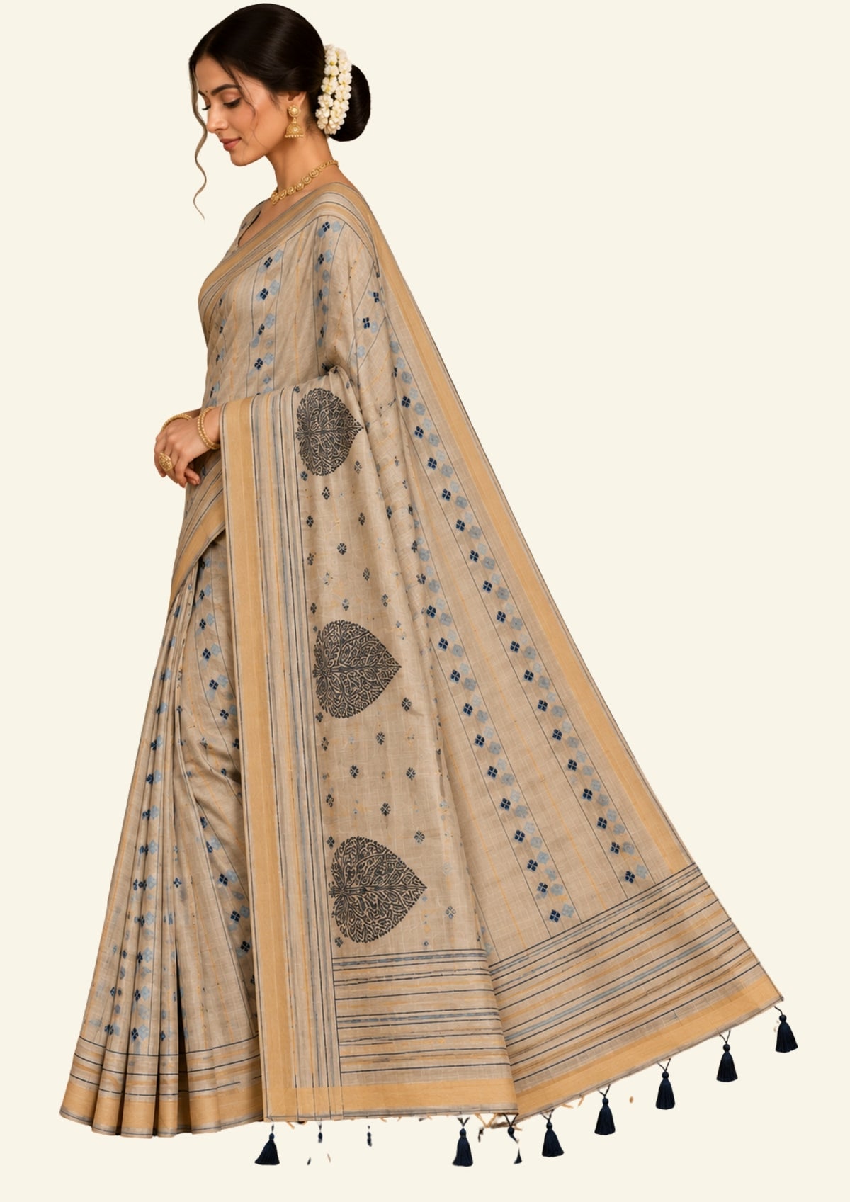 Beige Ishvani Tussar saree with black tassels