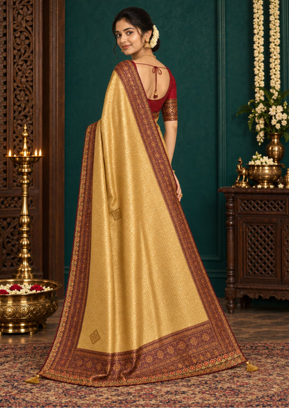 Golden cream Raj Virasat Silk saree with Deep purple base and heavy embroidery.