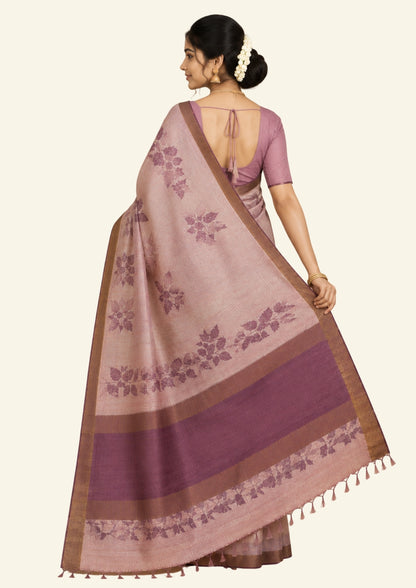 Harini Tussar in soft beige base with maroon leaf motifs and a matching brownish-maroon border, creating an elegant and earthy look.