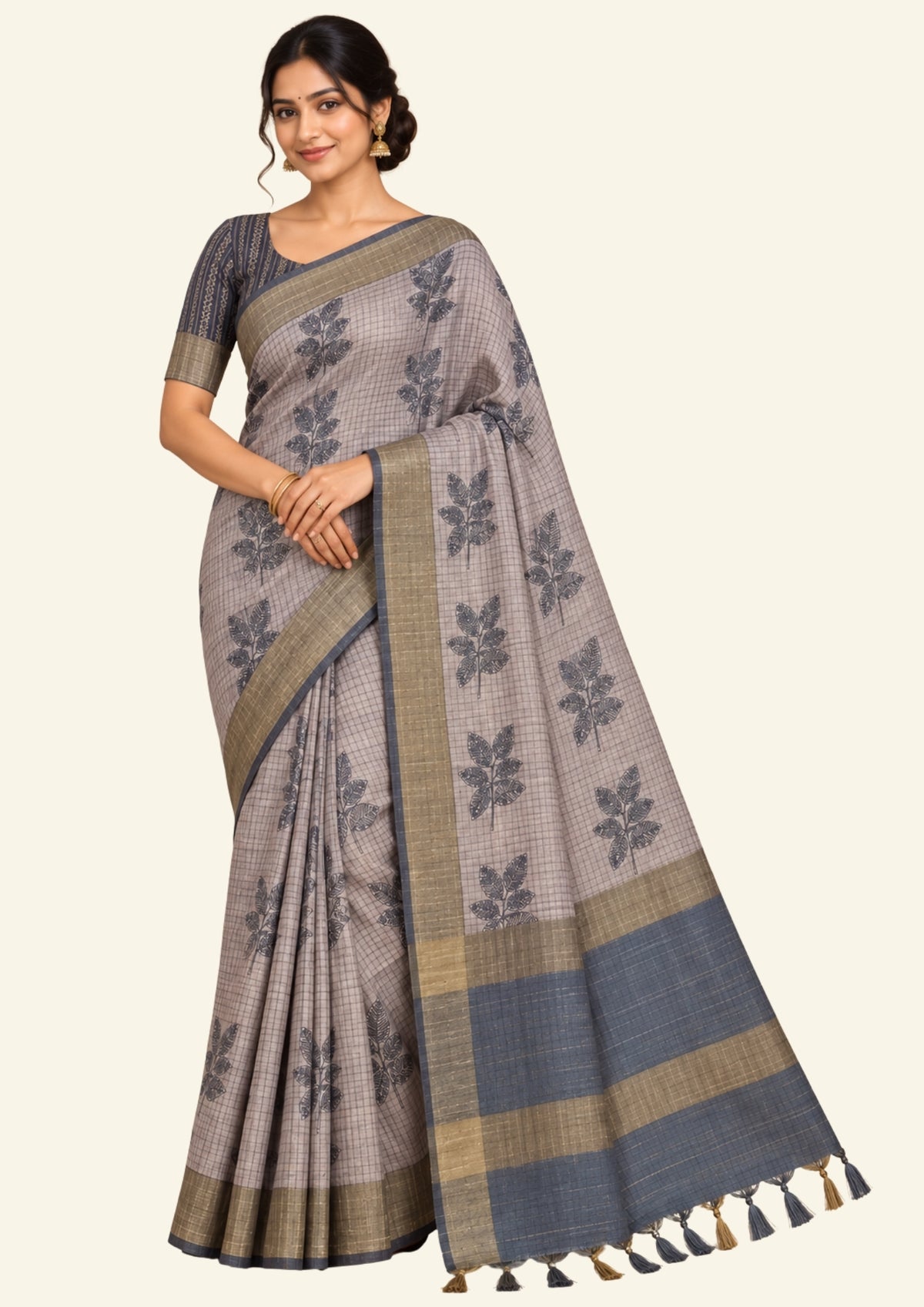 Harini Tussar in soft beige-grey base with a subtle checked pattern, beautifully accented by dark charcoal leaf motifs