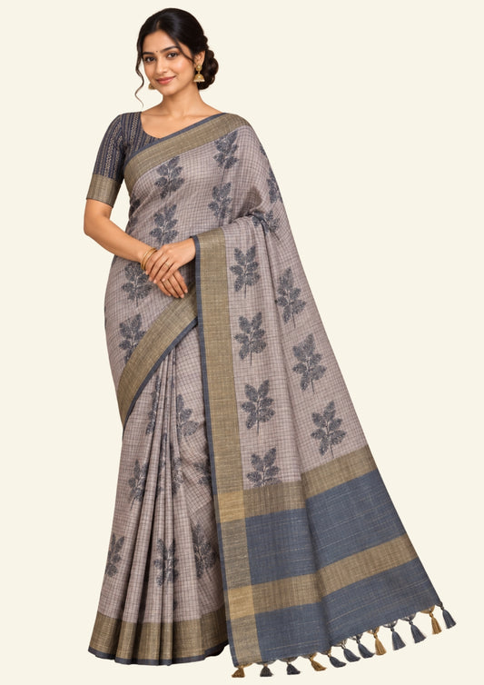Harini Tussar in soft beige-grey base with a subtle checked pattern, beautifully accented by dark charcoal leaf motifs