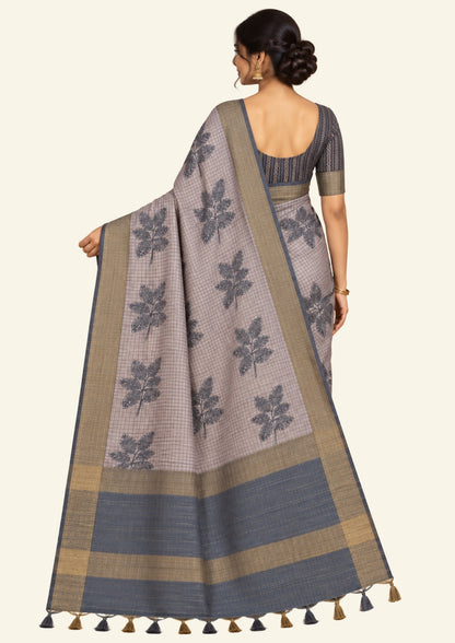 Harini Tussar in soft beige-grey base with a subtle checked pattern, beautifully accented by dark charcoal leaf motifs