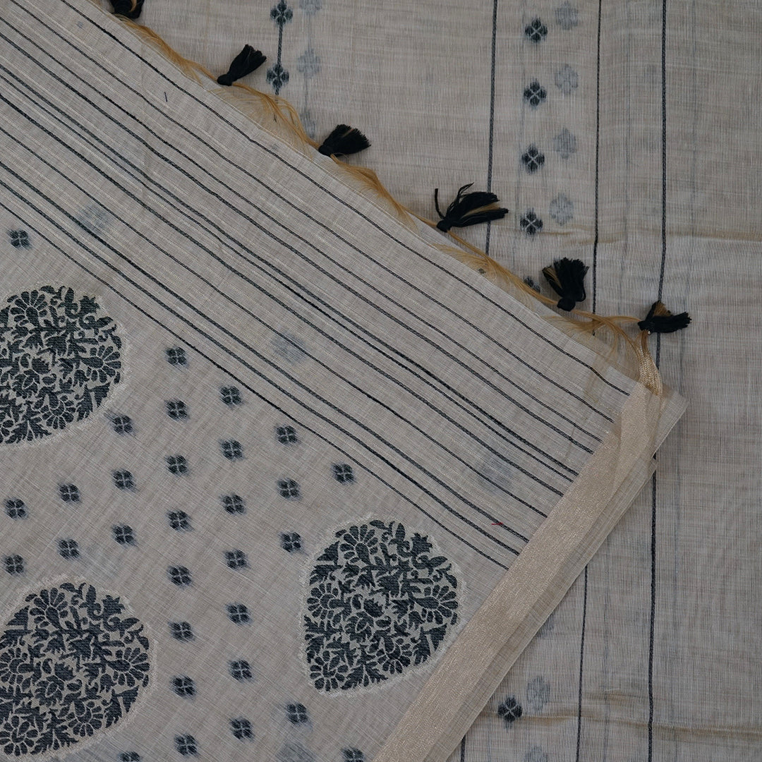 Beige Ishvani Tussar saree with black tassels