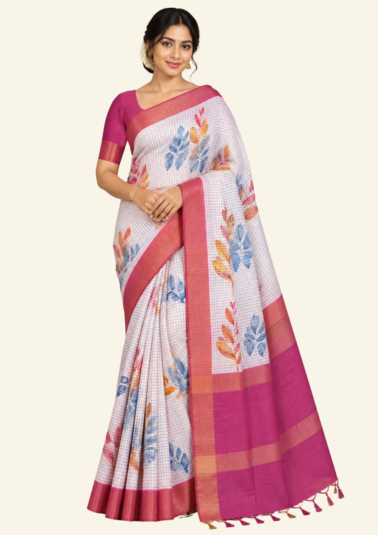 Harini Tussar in soft white base with colorful leaf motifs in blue, orange, and mustard, complemented by a rich maroon border.
