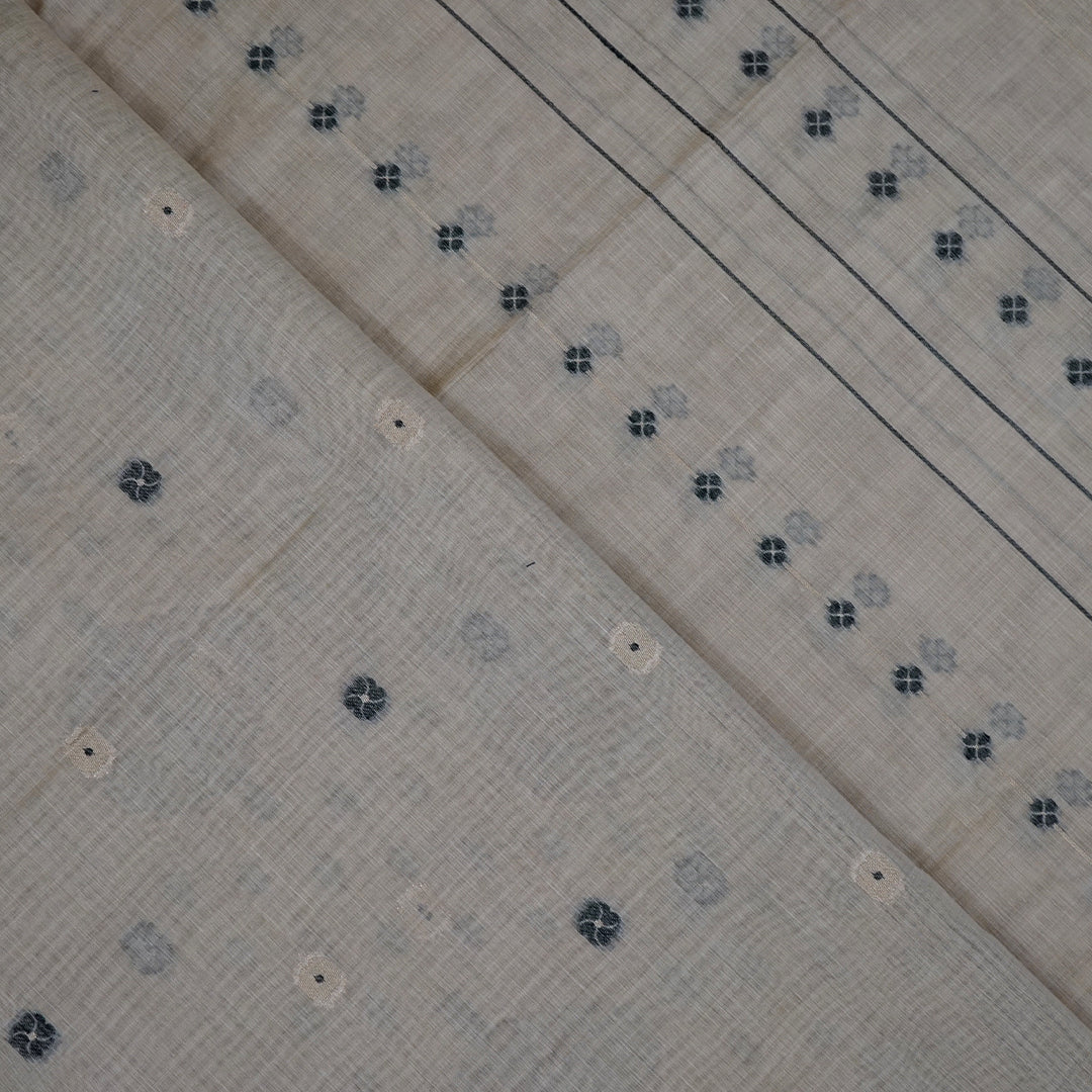 Beige Ishvani Tussar saree with black tassels